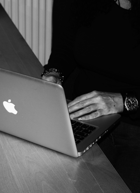 Image of Kaz working on a MacBook